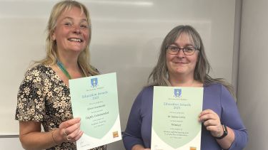 Alison and Sabine holding their highly commended certificates at the Education Awards