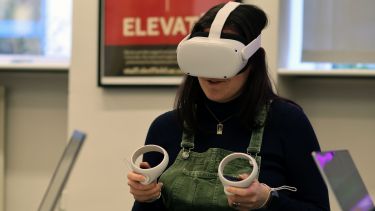 A student using a virtual reality headset.