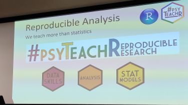 A presentation slide in lecture theatre 4 The Wave on Reproducible Analysis