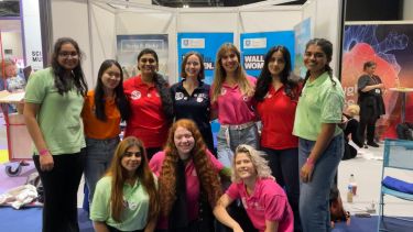 Photography of Garima at New Scientist Live fair in London 2022 - Building simple snap circuits with children at the New Scientist Live fair in London 2022, as a part of the Women in Engineering Society