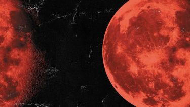 A red moon on a black background