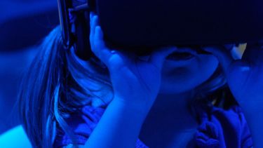 Image of young girl wearing a VR headset