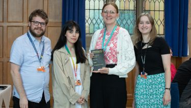 Image of the Green Impact Team accepting their Gold Award