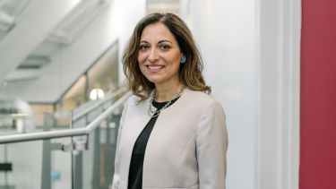 Maria-Teresa Speziale wearing a white blazer and black top.