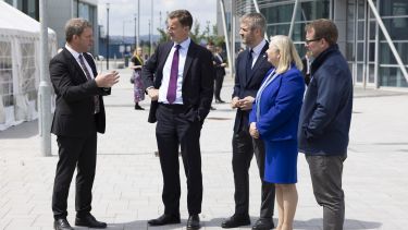 Representatives from the University of Sheffield and its AMRC speaking to UK Chancellor Jeremy Hunt outside of Factory 2050 at the announcement of the South Yorkshire Investment Zone