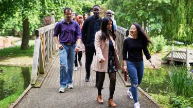 International Student Ambassadors walking through Weston Park in the summer