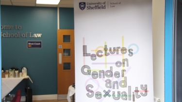 The Lectures on Gender and Sexuality banner in the door way to the foyer of the moot court