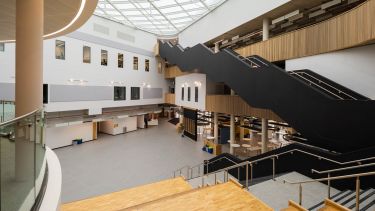 Interior shot of the Wave, looking over stairs, atrium and cafe