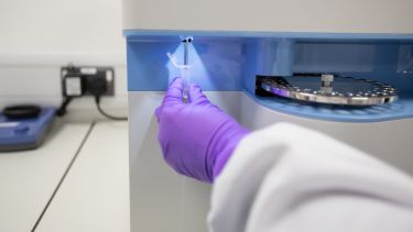 Researcher using lab equipment in the Gene Therapy Innovation and Manufacturing Centre