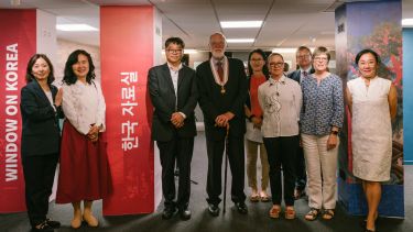staff from the National Library of Korea, the Korean Culture Centre, and the University of Sheffield stand together in the Window on Korea space