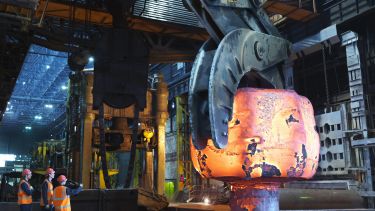 Hot Steel Moving Into Forging Machine