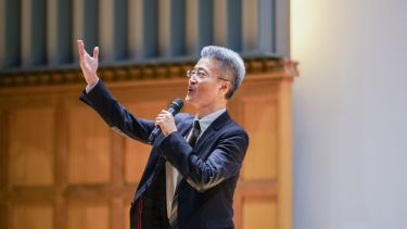 Professor Hongyan Li recites on stage
