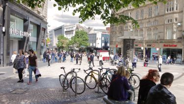 A photo of Sheffield city centre showing people shopping 
