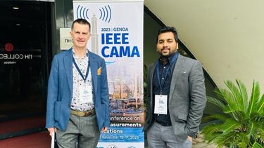 Image of Eddie and Sumim outside the IEEE CAMA