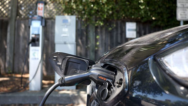 A close up of an electric car charging