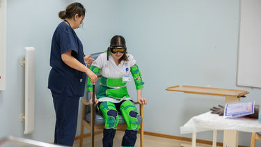 Nursing student wears equipment which simulates mobility and vision issues