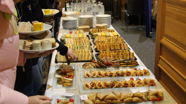 Food at Lectures on Gender and Sexuality event, including sandwiches, samosas and pastry boats