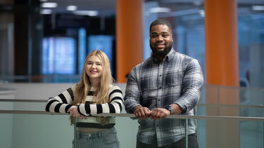 Two Sheffield undergraduate students smiling at the camera