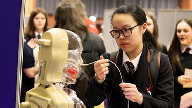 girl interacting with activity at STEM for girls