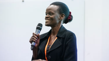 Loice Natukunda presenting.
