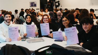 Students from Project Pixel holding certificates they have been presented with