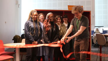 Student associates cut the ribbon at the Exhibition Space in the IC