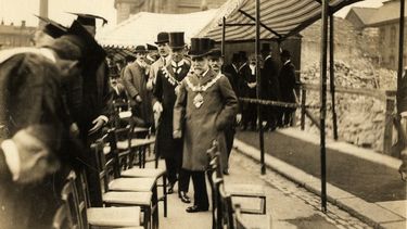 Academics and officials attending a ceremony for laying the cornerstone of the University of Sheffield.