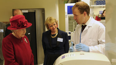 Queen Elizabeth II is given an overview of the research undertaken at SITraN