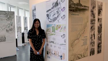 Landscape student standing next to their work at the 2024 exhibition