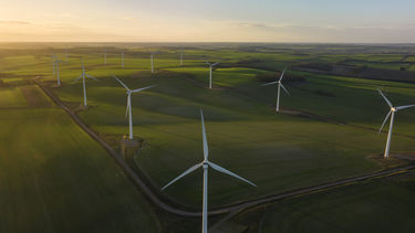 An image of windfarms on top of hills