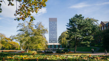 The Arts Tower as seen from Weston Park in the autumn. Western Bank library at the foot of the Arts Tower.