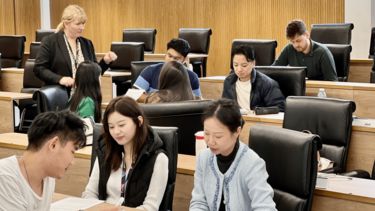 Marian, a careers consultant, working with students in a lecture theatre.