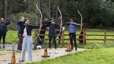 MBA students doing archery.