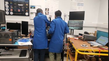 Eddie Ball and Sumin Joesph David conducting experiments in the facility