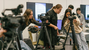 Students operating cameras