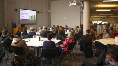 Staff and students sitting in The Digital Commons