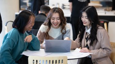 3 Philosophy students around a table