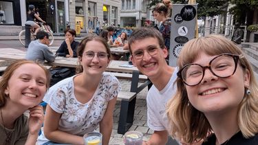 four students smiling at the camera for this selfie taken in Ghent