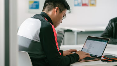 A student working on a laptop