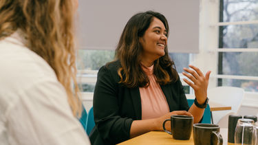 Smiling woman in conversation