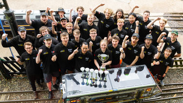 Students from Sheffield celebrating with their winning trophy