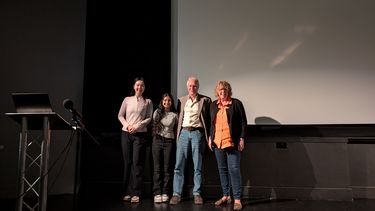 u3a showroom lecture series four people standing on stage