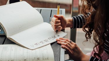 Student doing Japanese writing 