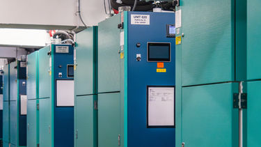 A view of a row of freezers inside a Biosciences lab