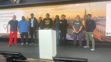 Demi and team winning the Google BGN Hackathon on stage