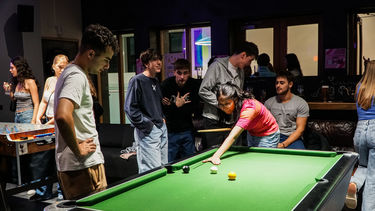 Students playing pool in University of Sheffield's Accommodation on-site bar, Edge Bar Endcliffe