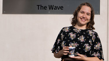 Sophie showing her Christmas cup design
