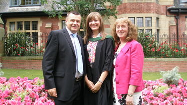 Gemma Middleton on her graduation day wearing a gown with her parents Nigel and Sharon