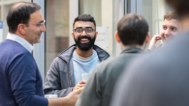 Group of people talking and laughing