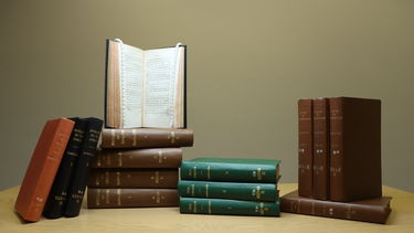 Lots of Ann Radcliffe's novels placed together on a table